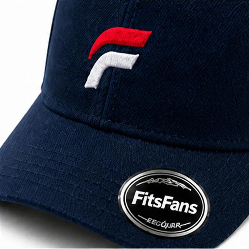Navy blue baseball cap with red and white embroidery and FitsFans sticker on the brim