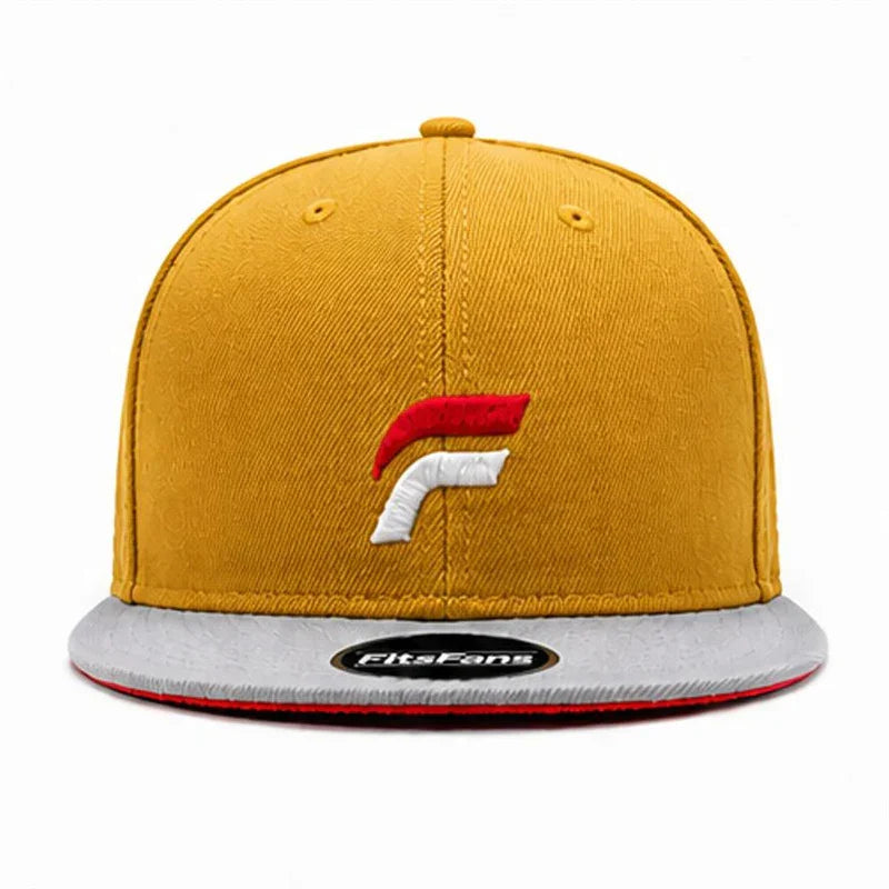 Yellow snapback hat with embroidered logo, gray flat brim, and modern streetwear style