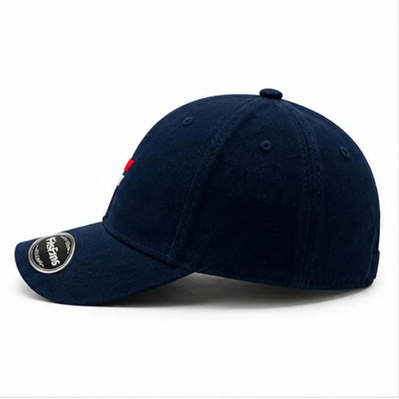 Navy blue baseball cap with side logo and curved brim, classic adjustable hat