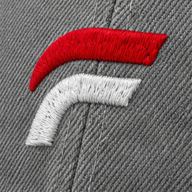 Close-up of a gray hat with red and white embroidered logo detail