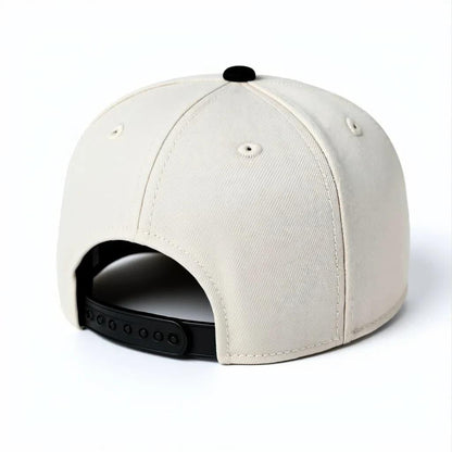 Beige snapback cap with black adjustable strap, rear view on white background